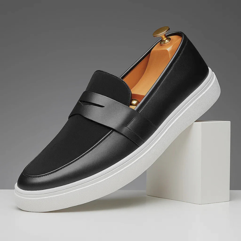 Men's slip-on loafers featuring a penny strap detail and flat rubber sole