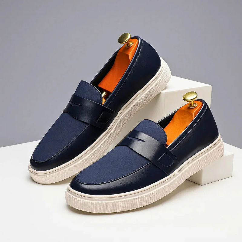 Men's slip-on penny loafers with a clean synthetic leather finish and low-profile sole