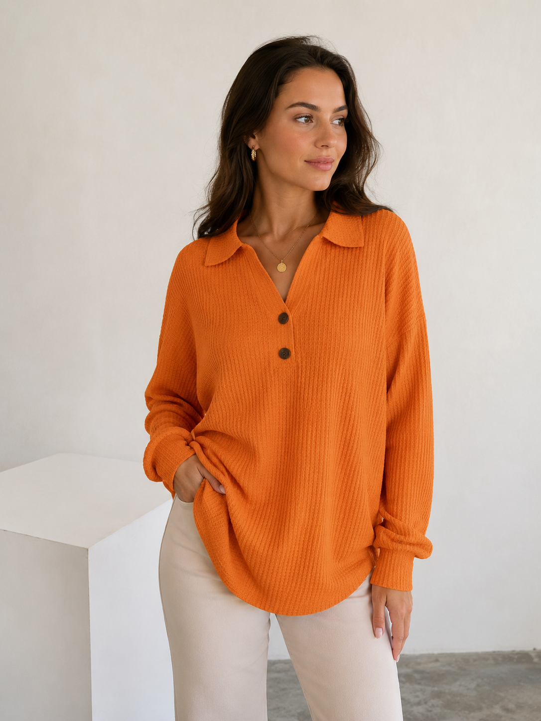 Women's relaxed-fit long-sleeved blouse with open collar and partial button placket