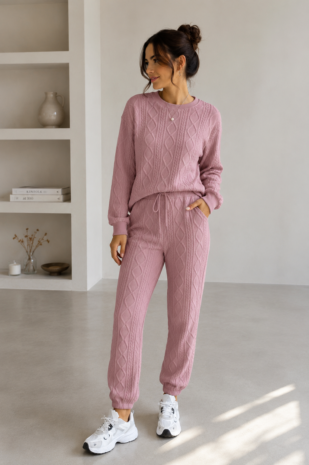 Matching knitted sweater and pants set with ribbed cable texture for women
