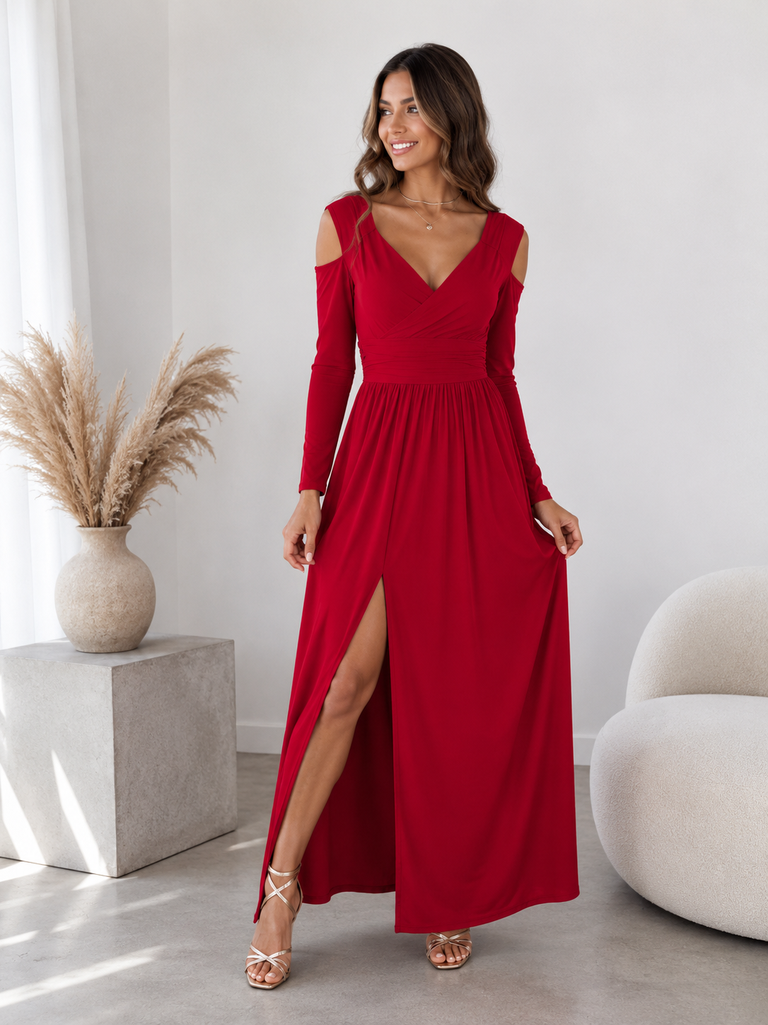 Long-sleeved women's wrap dress in maxi length with V-neckline, draped bodice, and gathered waist detail