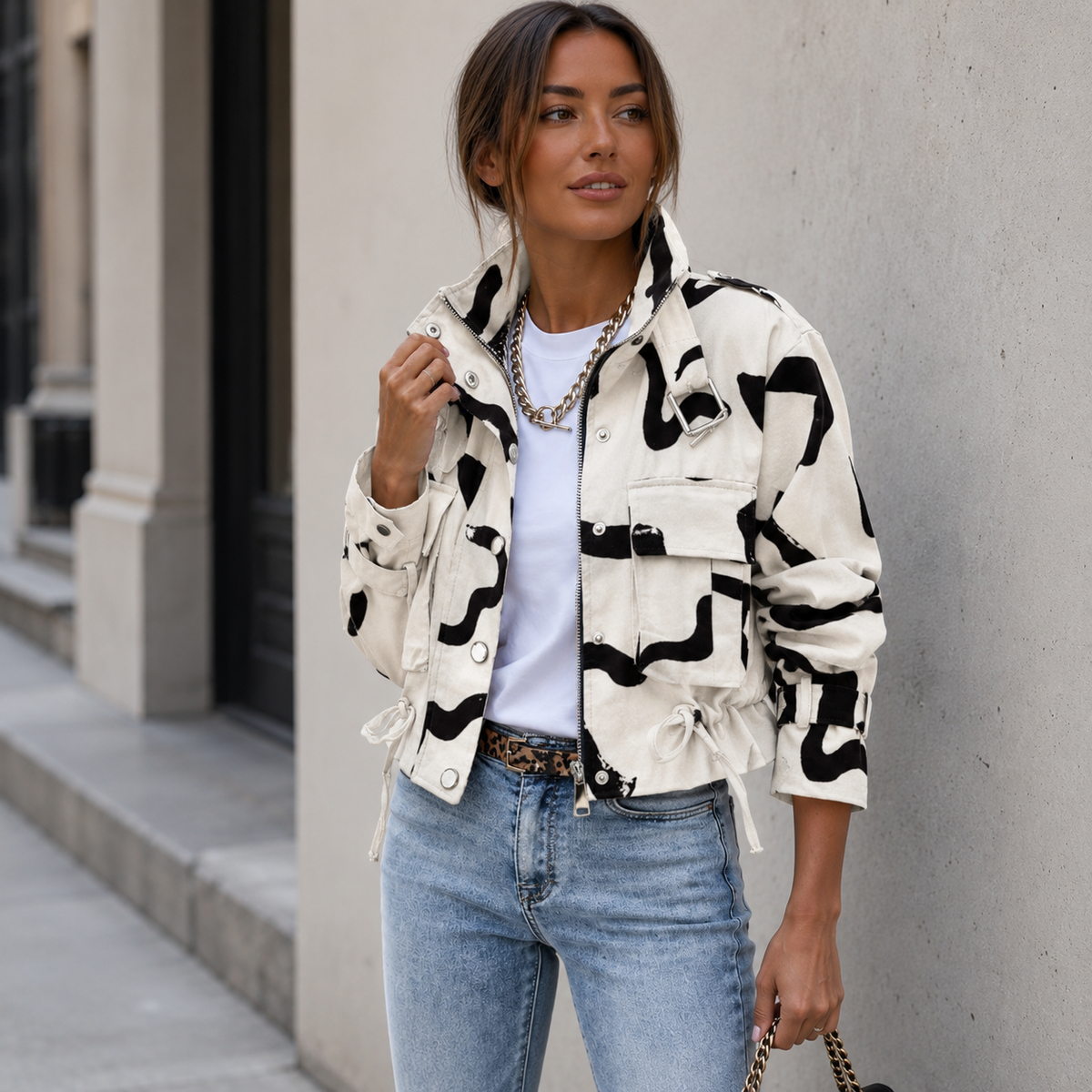 Cotton-blend women's utility jacket featuring a structured silhouette, snap button details, and waist-length cut