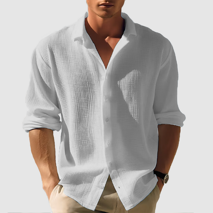 Chemise en tissu texturé, col structuré souple, manches longues, coupe ample homme