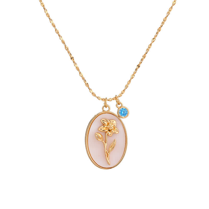 Collier à chaîne fine avec pendentif ovale floral et élément décoratif suspendu
