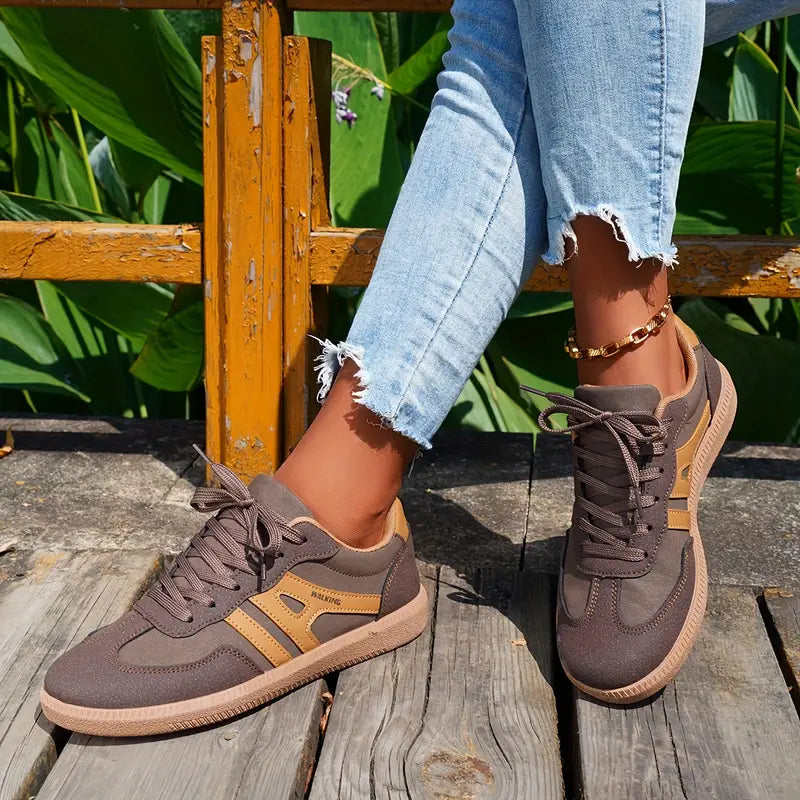 Women's lace-up sneakers with padded heel collar and patterned rubber outsole