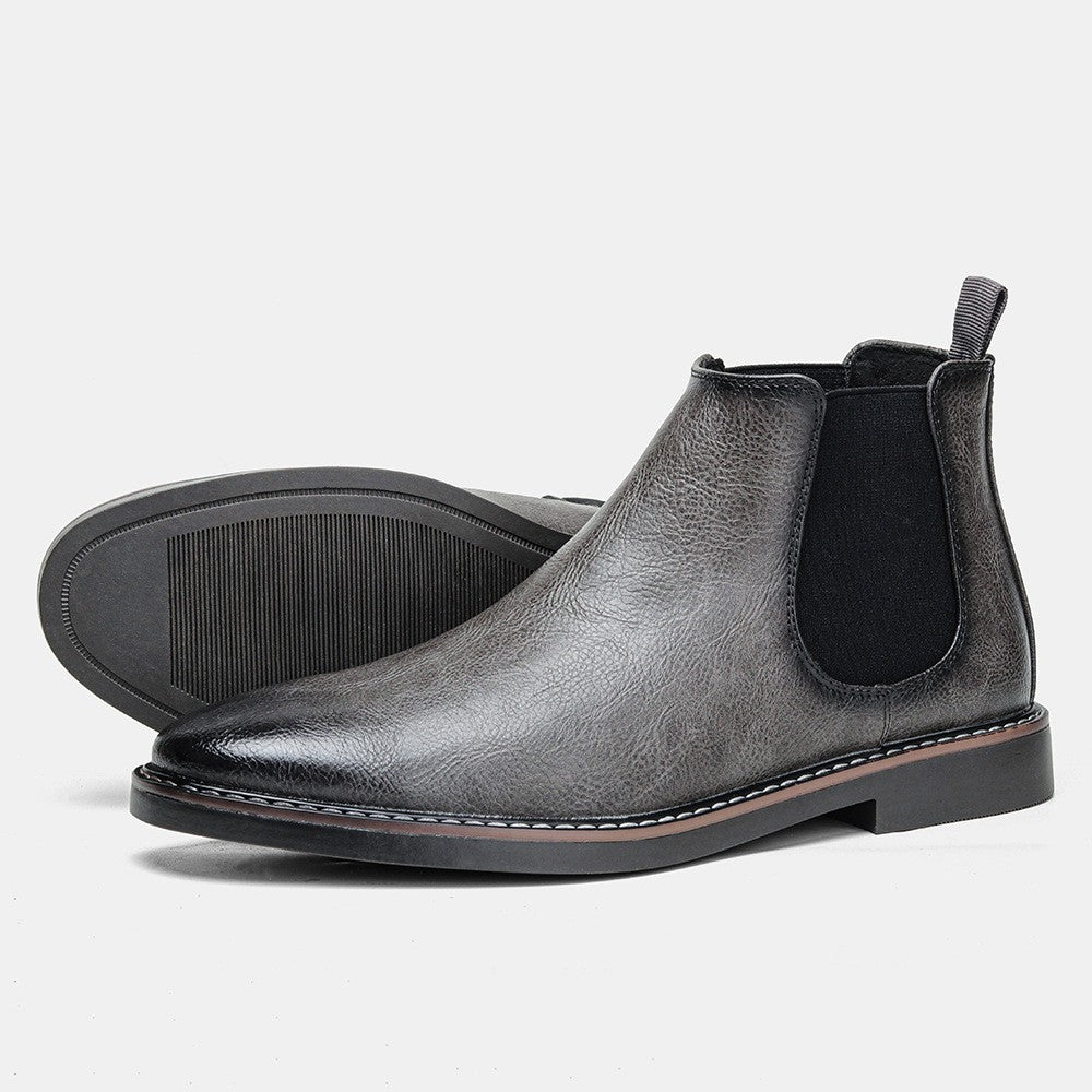 Close-up of men's Chelsea boot sole and heel construction, rubber outsole detail