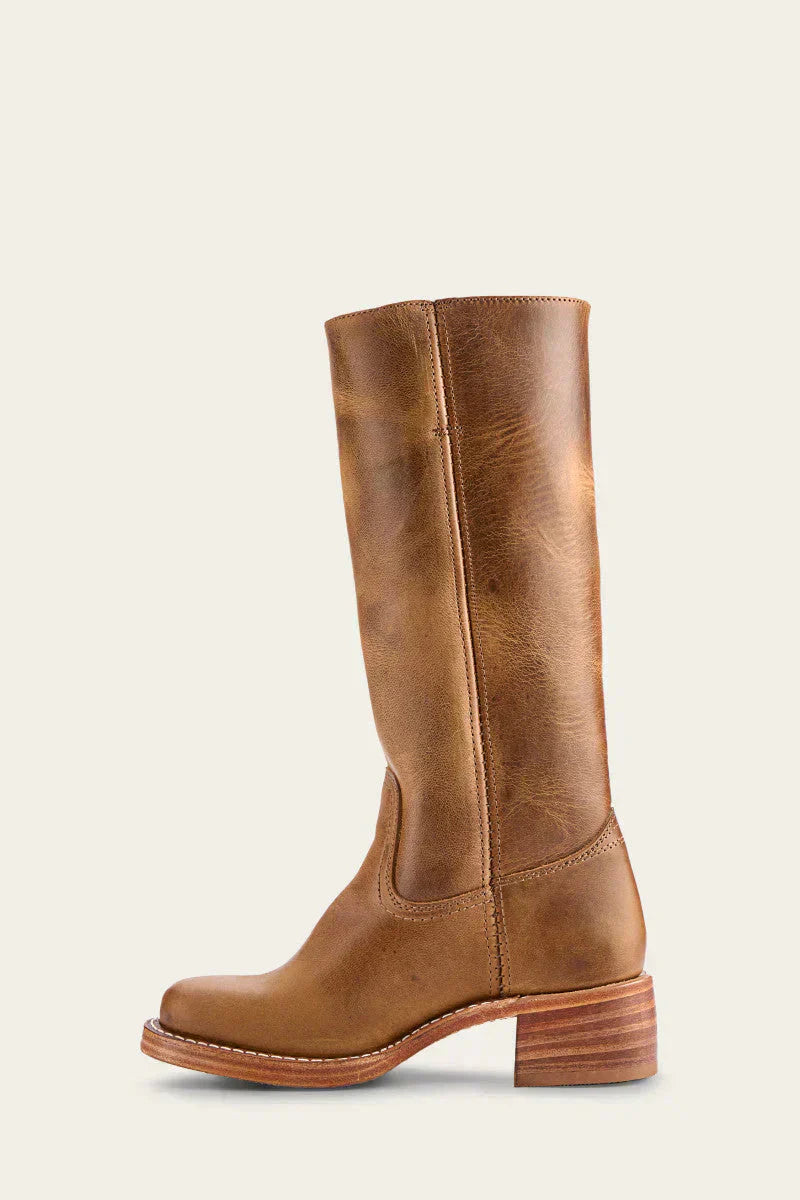 Women's tall faux leather boots styled with casual outfit, full-length lifestyle shot