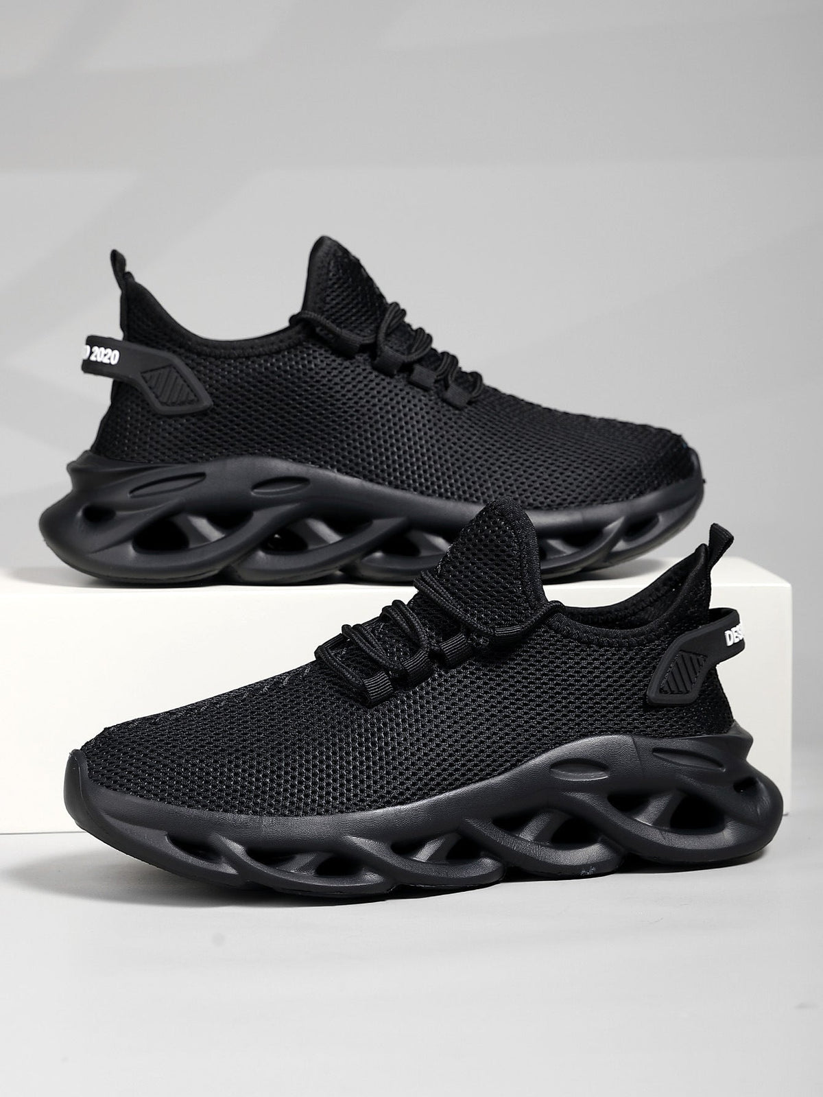 Men's lace-up sneaker in breathable synthetic mesh, rear three-quarter view