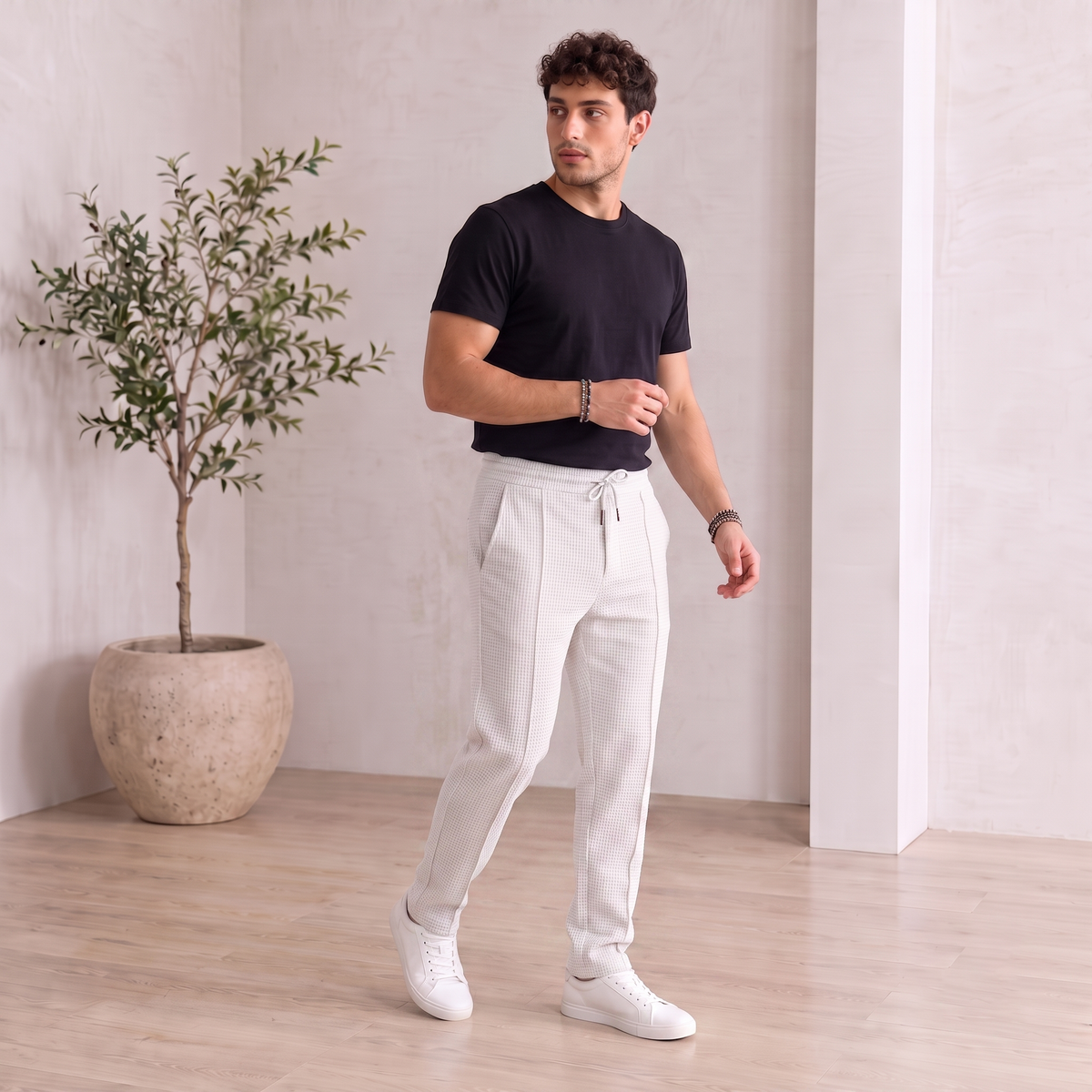 Men's drawstring trousers with structured woven texture and tapered leg