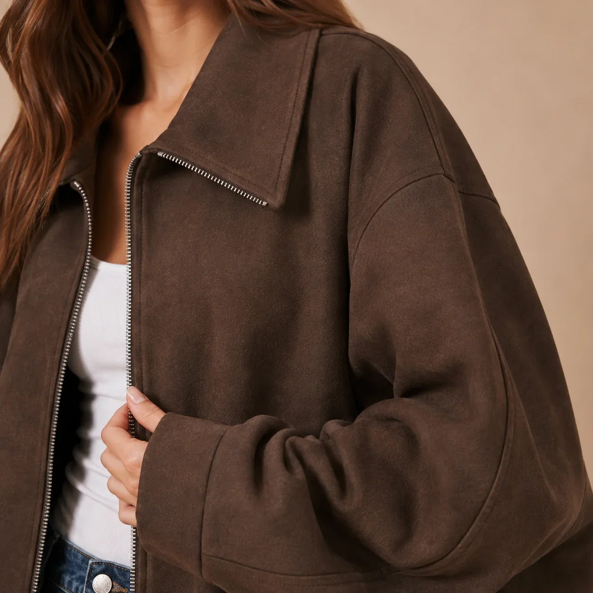 Close-up of brown jacket collar zipper and dropped shoulder
