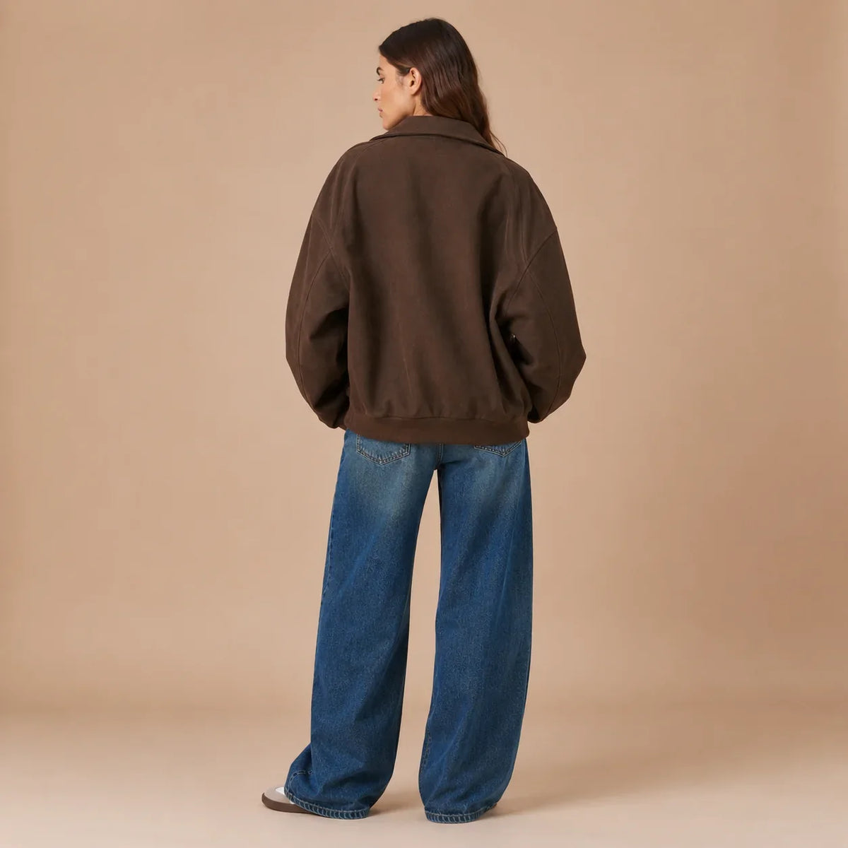 Back view of women's brown loose fit jacket with dropped shoulders