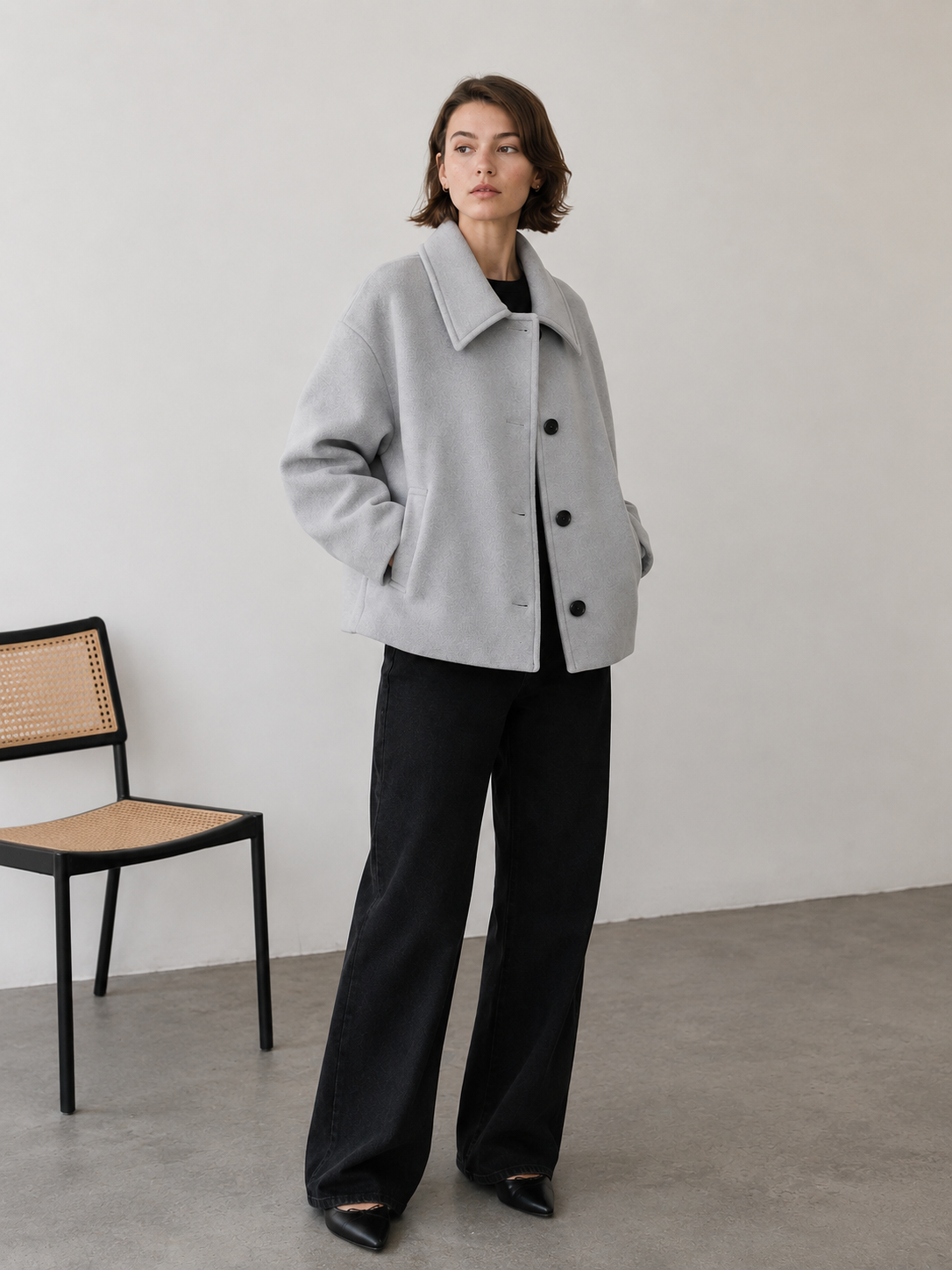 Women's short wool-blend coat with minimalist button front and side pockets