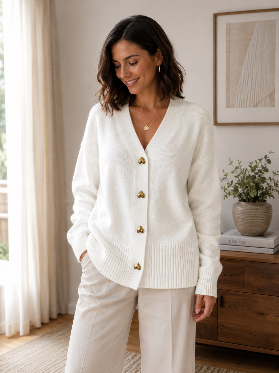 Women's fine-knit button cardigan with V-neck and ribbed edges, layering style