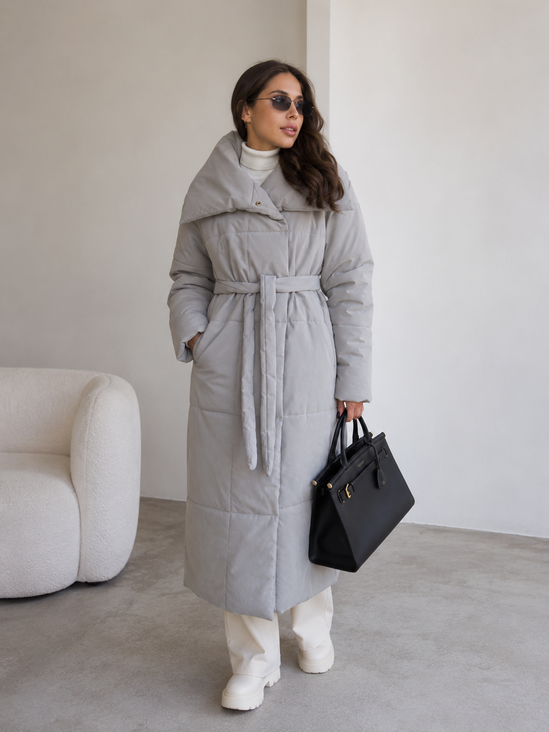 Long padded women's coat with structured wide collar