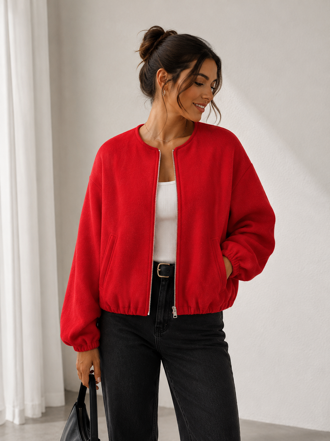 Women's short bomber-style jacket with side pockets and front zip closure