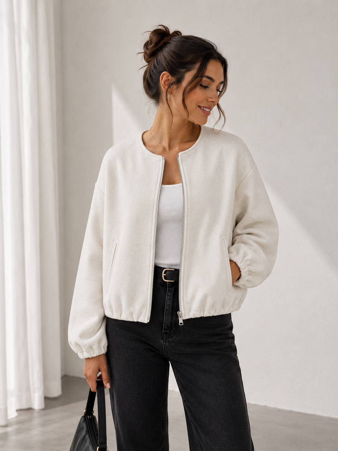 Women's short zip-up jacket with dropped shoulders and structured shape
