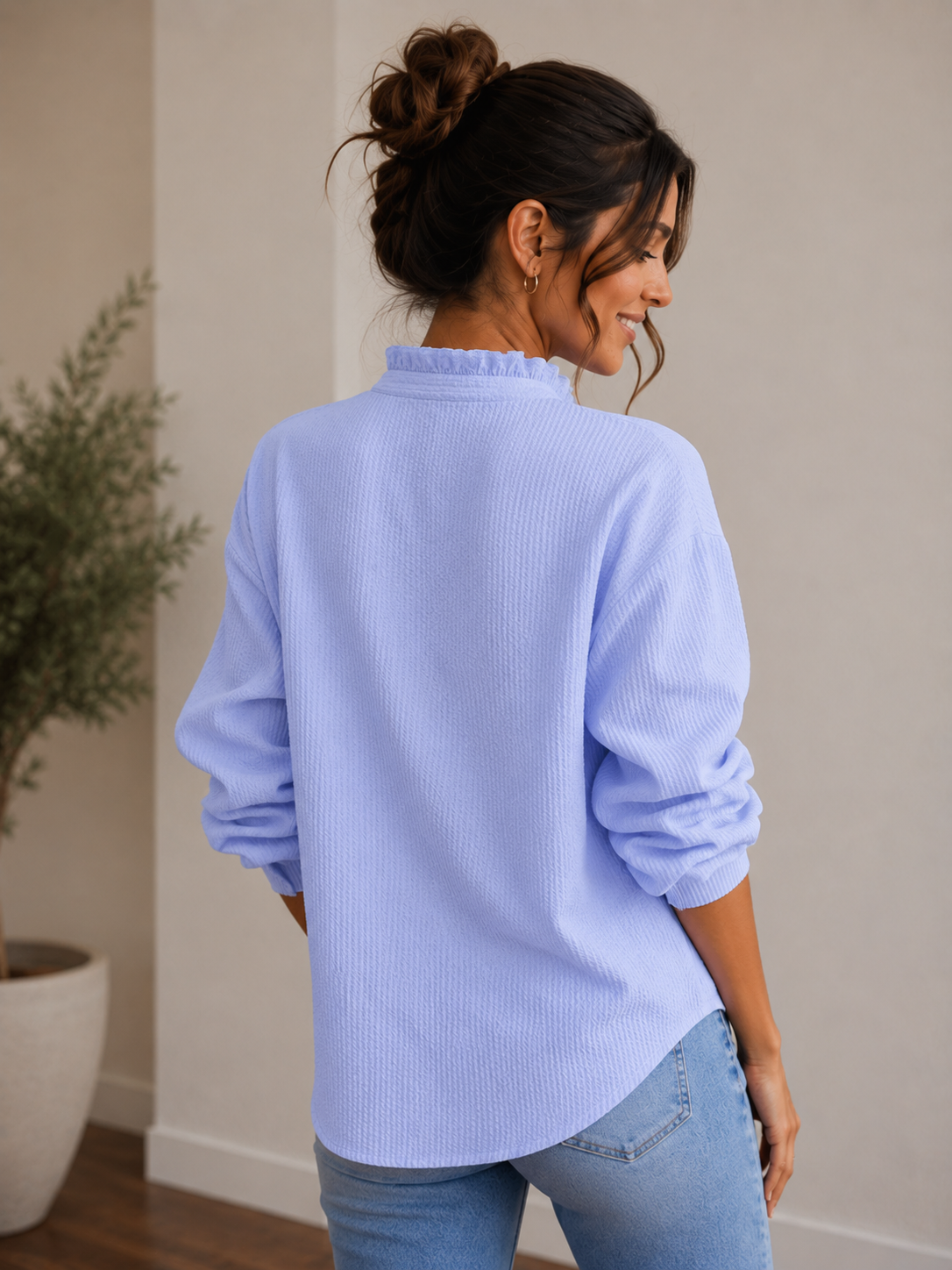 Women's textured blouse with gathered cuffs and ruffle front detail