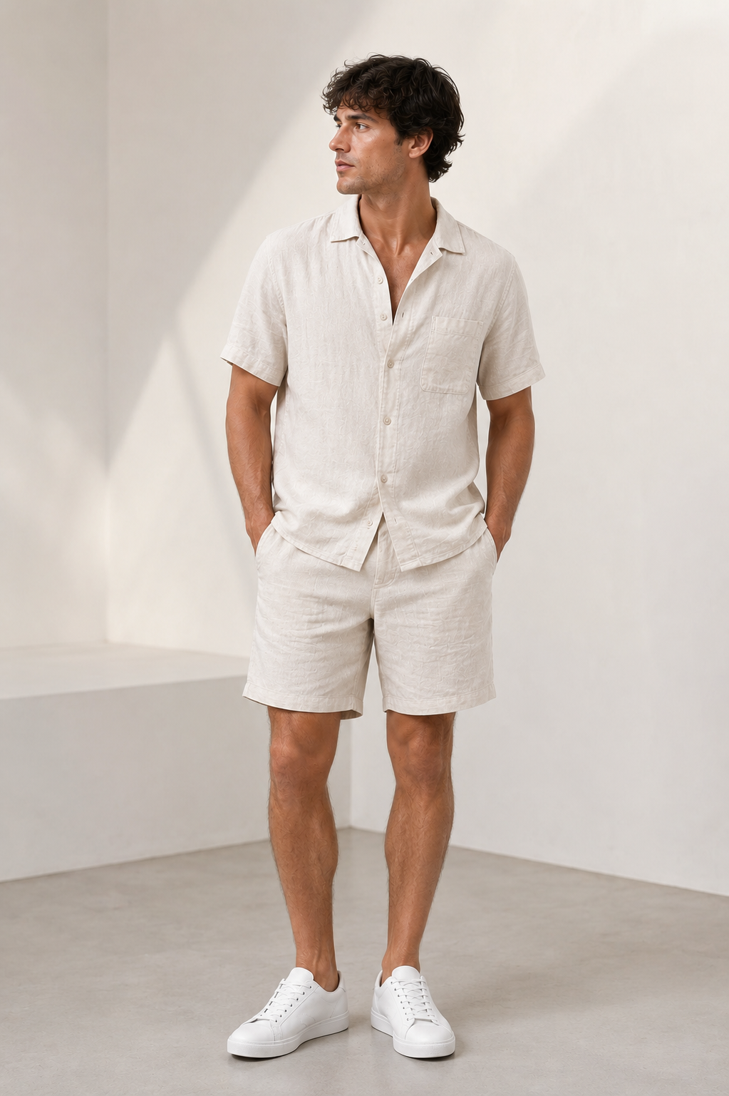 Men's linen set with short-sleeved button-up shirt and matching shorts, relaxed fit with open collar and elastic waistband