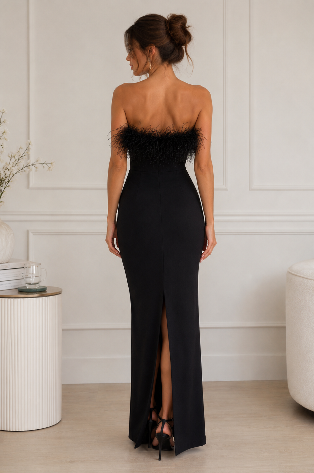 Strapless maxi dress with feather detail along the neckline, full-length skirt