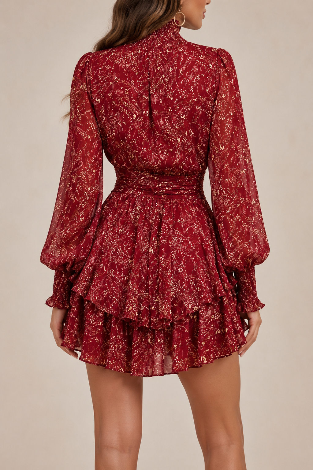 Women's short floral dress with high collar, sheer sleeves, and tiered ruffle hem detail