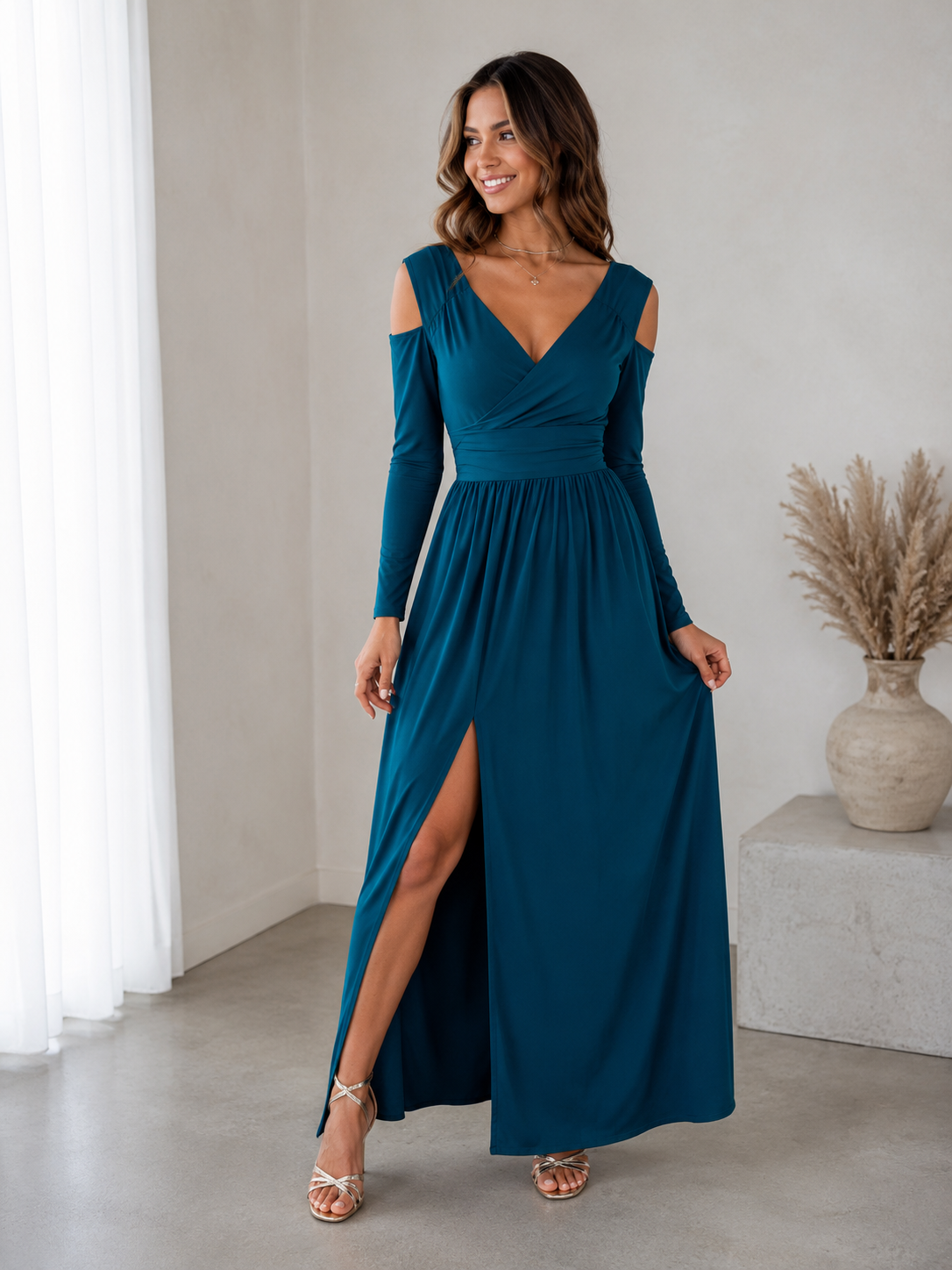 Women's maxi wrap dress with long sleeves, gathered waist, and a flowing skirt with a front slit