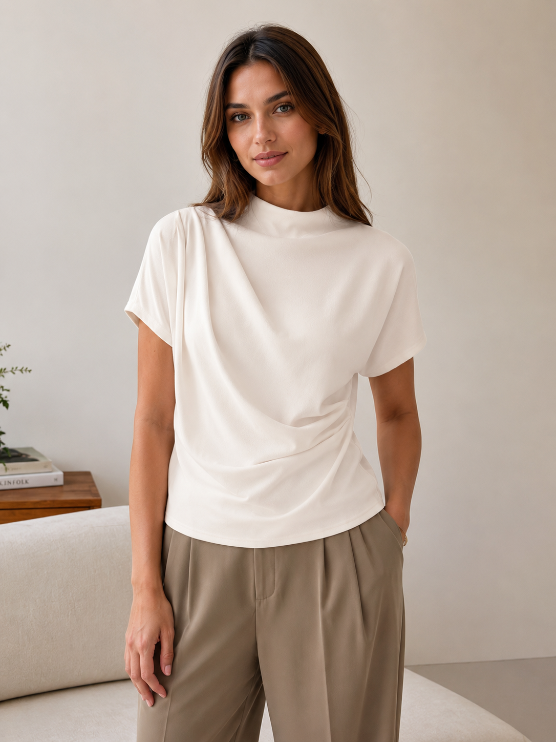 Women's draped top with asymmetric front draping and high neckline