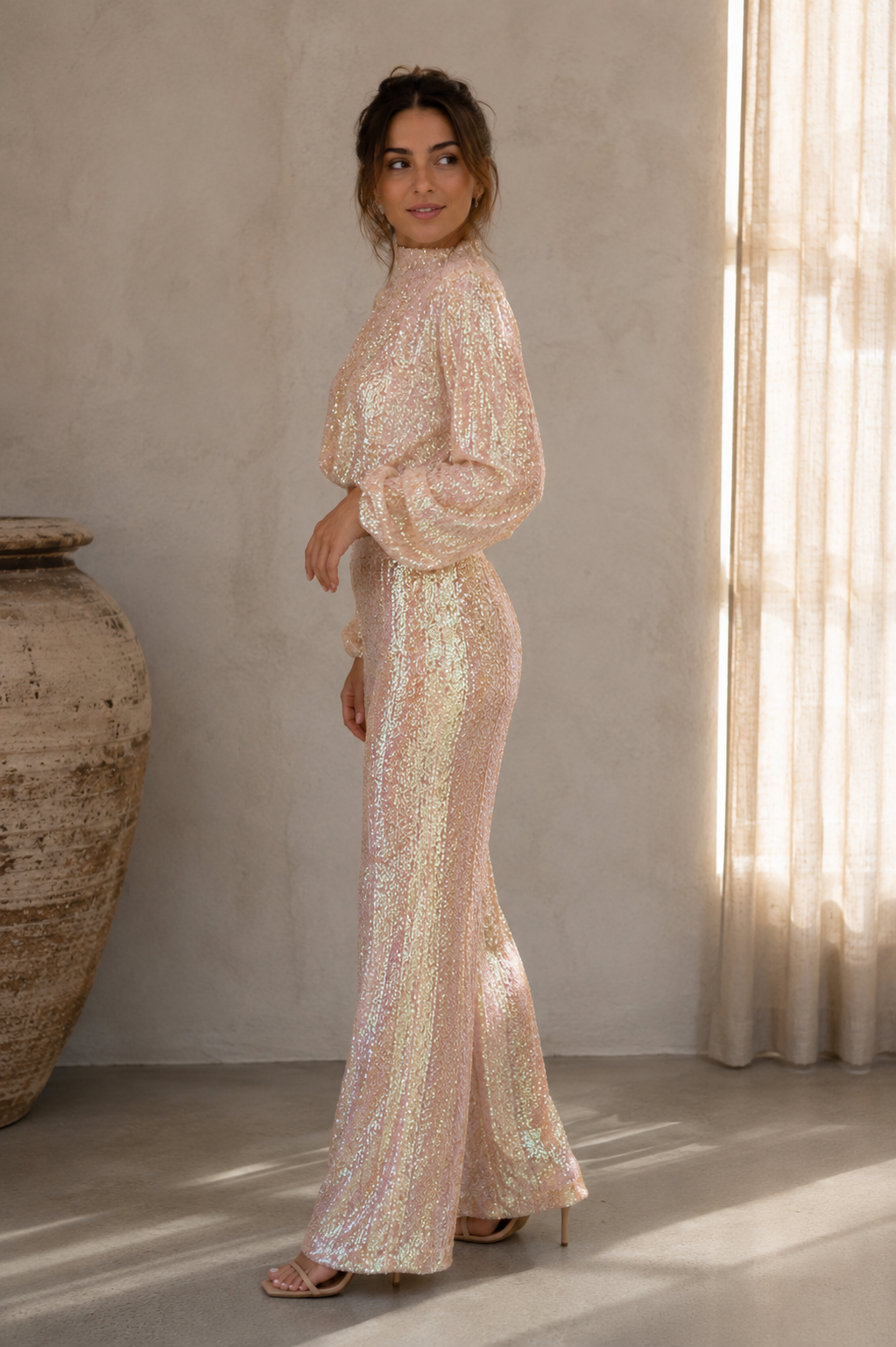 Women's coordinated sequin outfit with long-sleeve top and high-waisted pants in mesh fabric