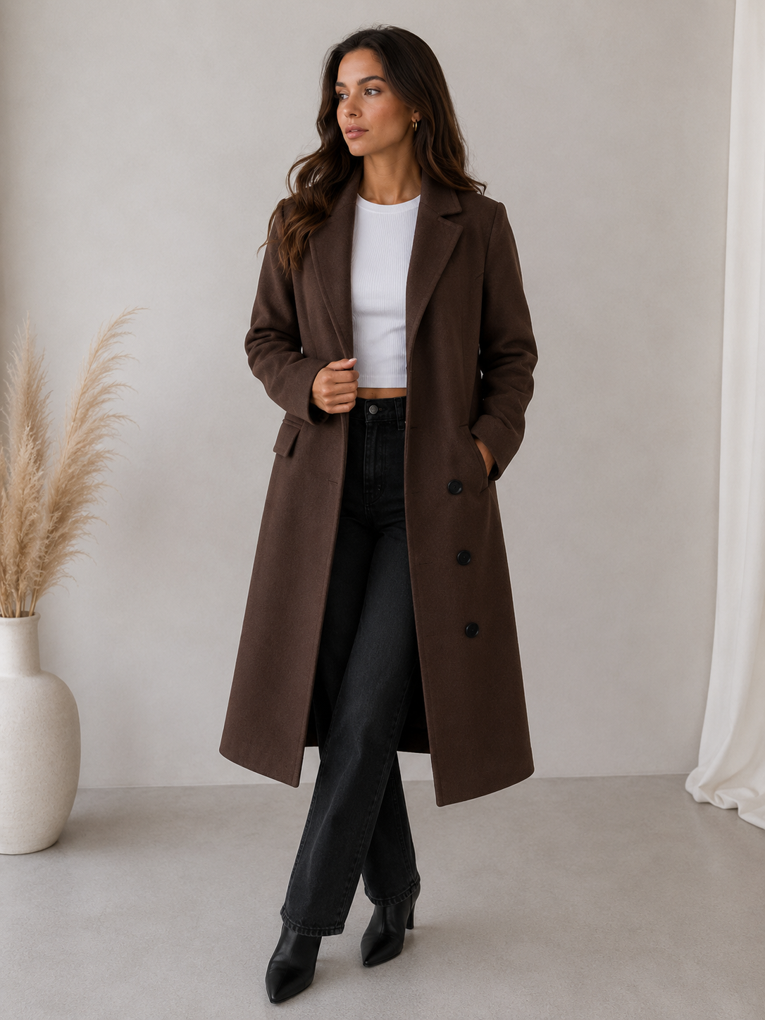 Tailored long coat for women with structured silhouette and button placket