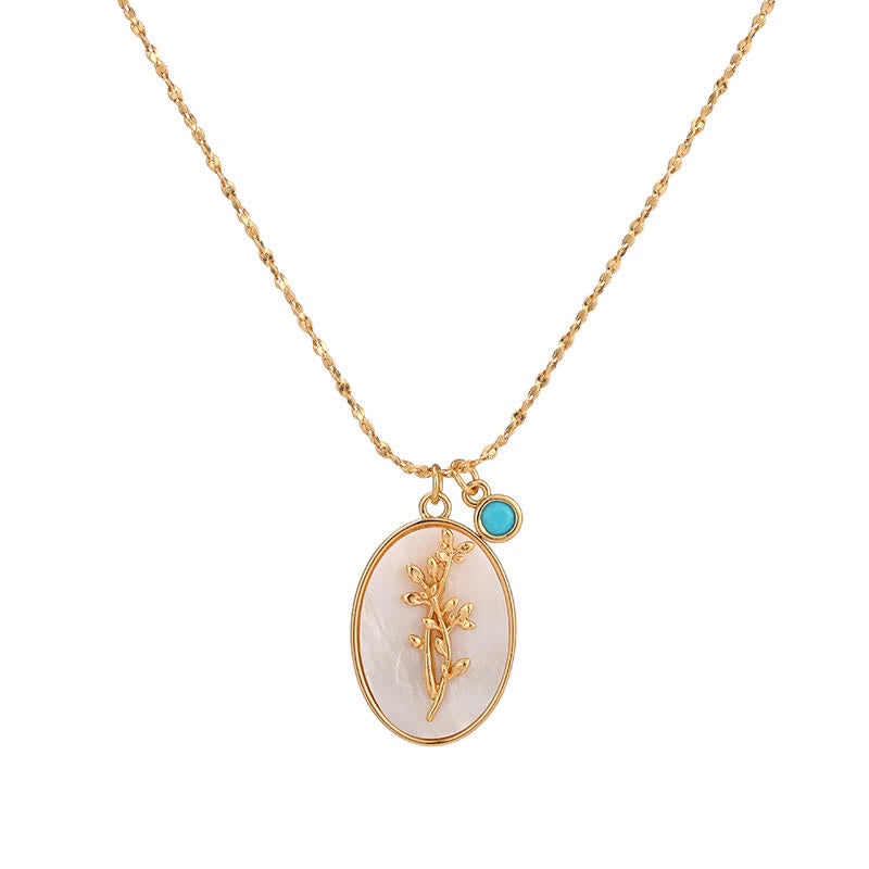 Collier pendentif ovale avec fleur styliséeinsert translucide et charm décoratif