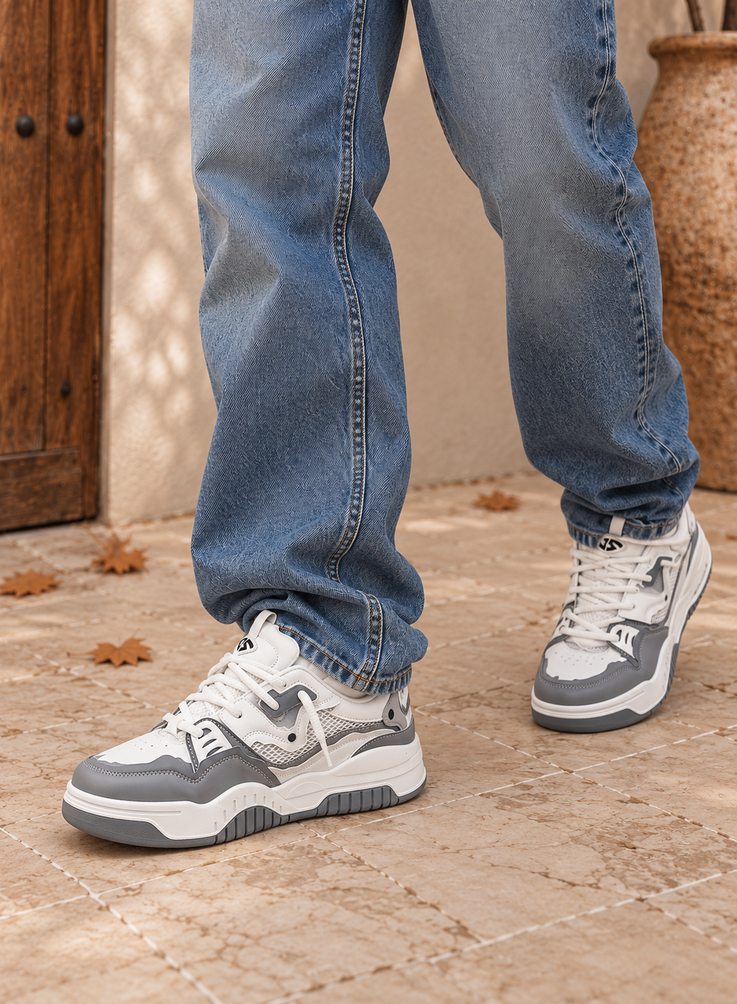 Men's chunky sole sneakers featuring panel design, contrast stitching, padded tongue with pull tab, and patterned rubber outsole