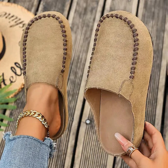 Women's suede clogs slip-on style with open heel and round toe detail
