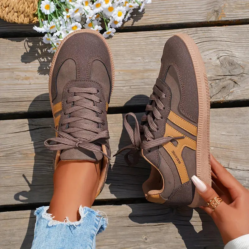 Women's everyday sneakers with stitched panel detailing and round toe silhouette