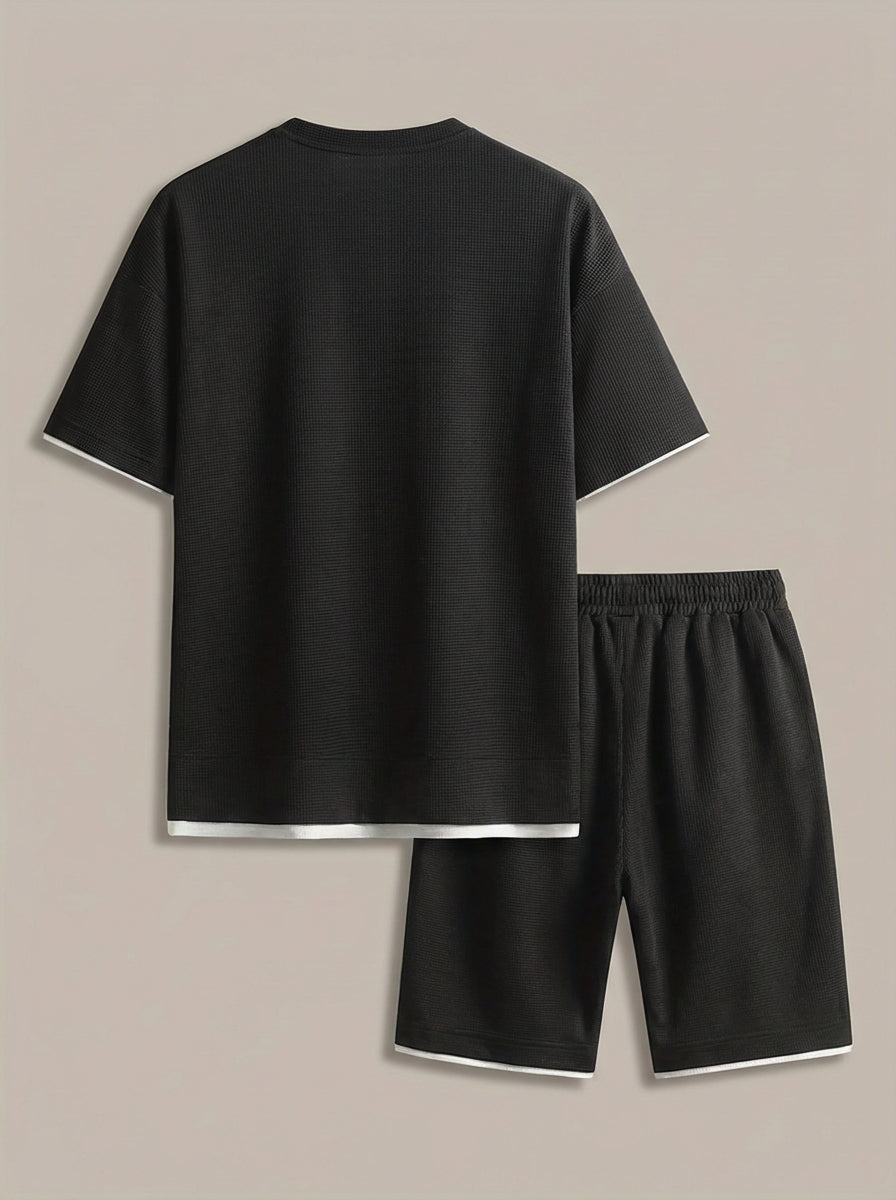 Men's coordinated t-shirt and shorts set in structured fabric, suitable for spring and summer