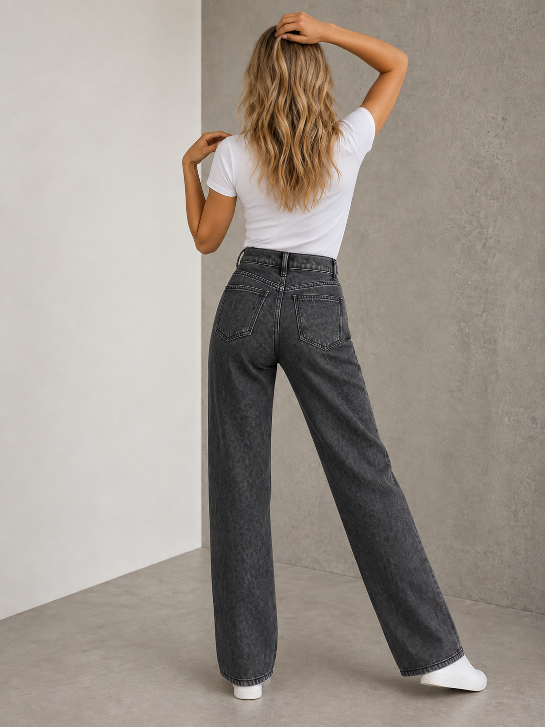 High-waist washed denim jeans for women featuring belt loops, button-and-zipper closure, and straight-leg cut
