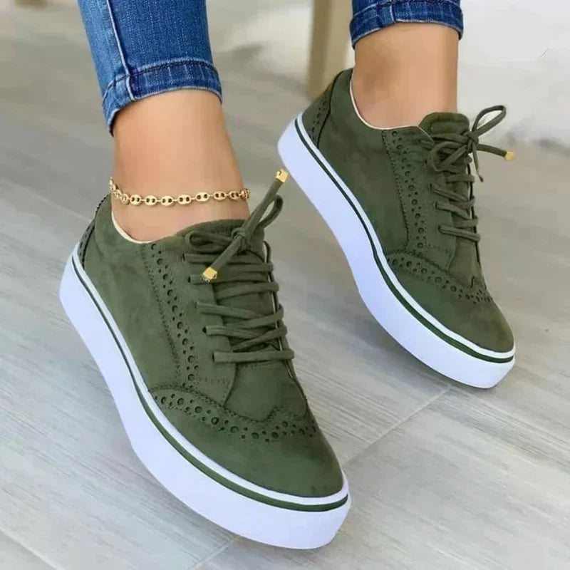 Women's platform sneakers with lace-up front, perforated upper, and contrasting rubber sole