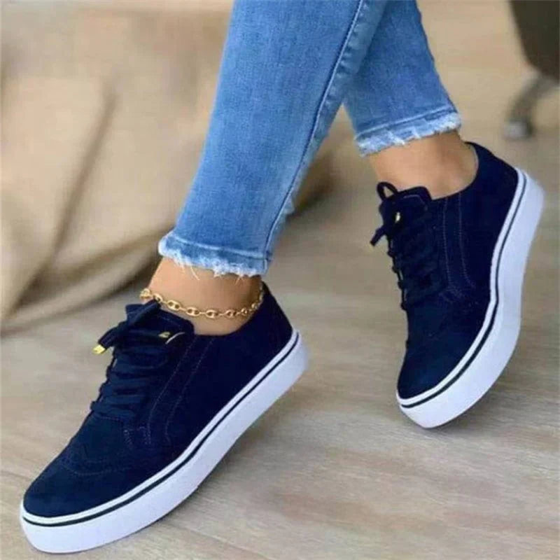 Women's suede-like platform sneakers with lace-up closure, perforated detailing, and stitched construction