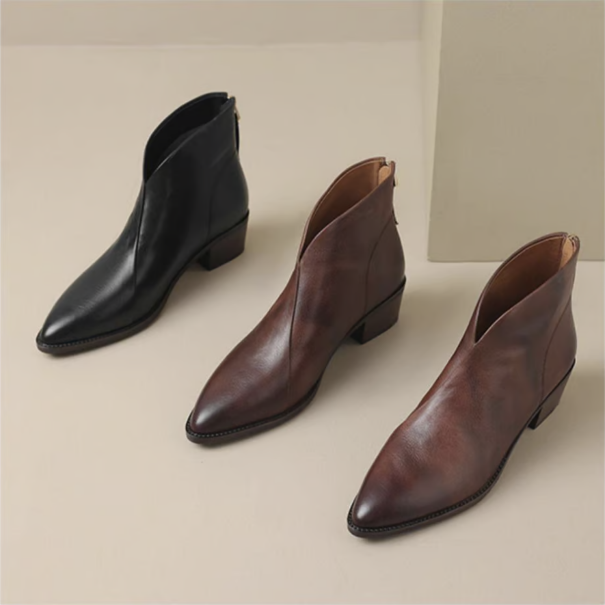 Women's leather ankle boots rear view with structured block heel
