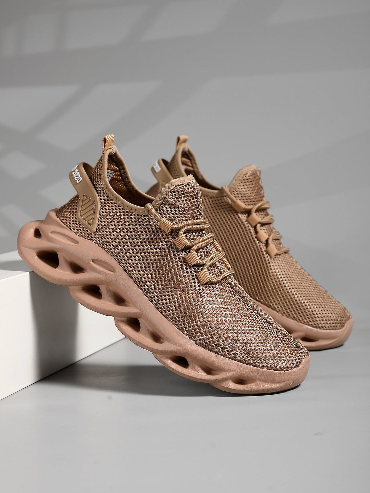 Men's everyday mesh sneaker with round toe and molded sole, lateral side view