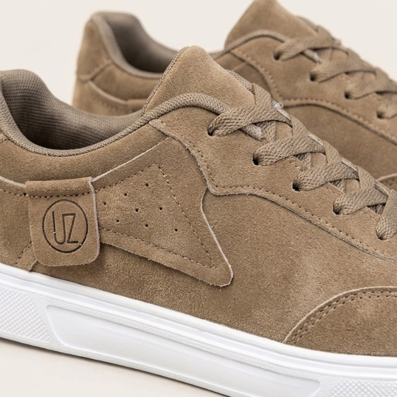Men's suede sneakers featuring round toe, lace-up closure, and patterned grip outsole