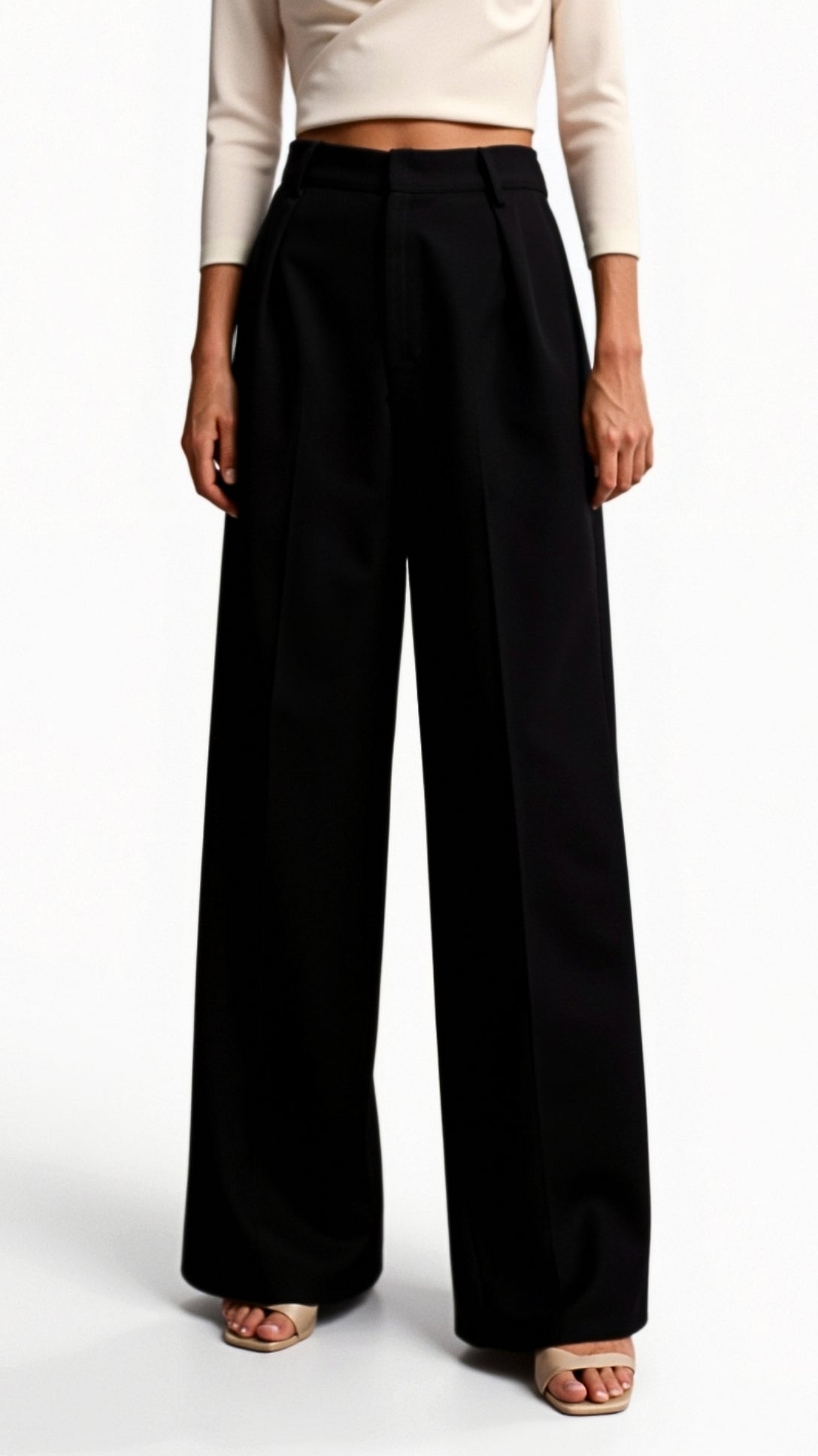 Pantalon taille haute à jambes larges, plis structurés à l'avant, silhouette entière