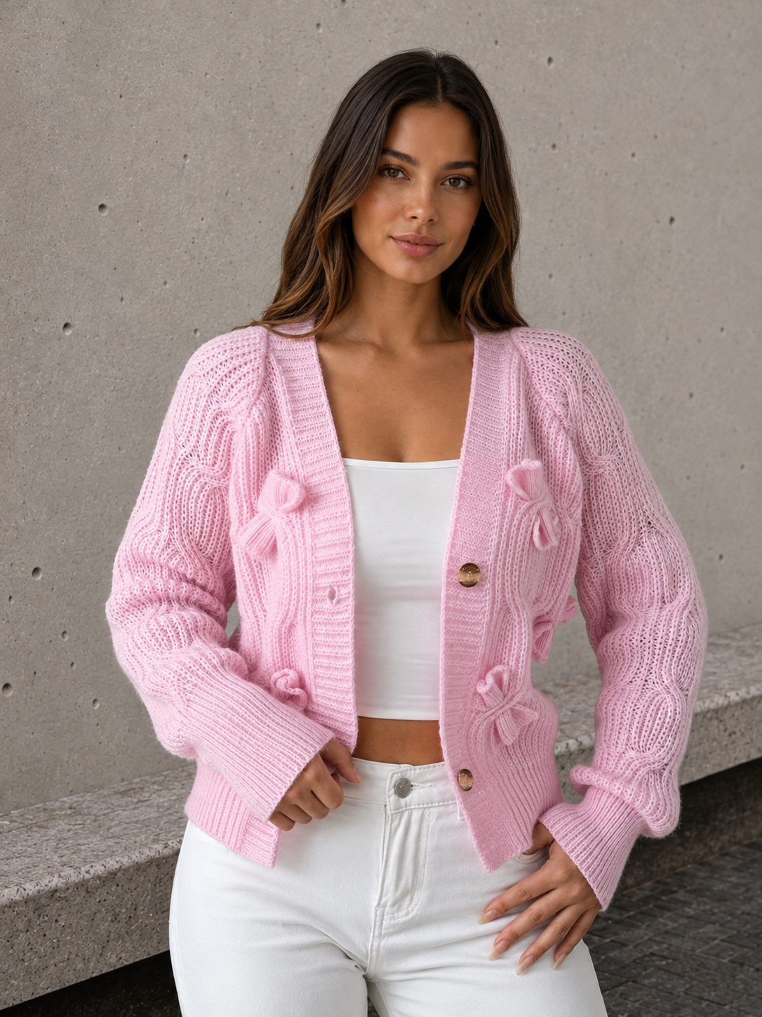 Women's knitted cardigan back view showing fitted cut and knit texture