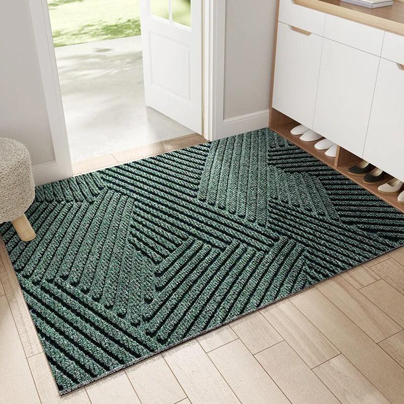 Tapis d’entrée vert avec motif géométrique texturé