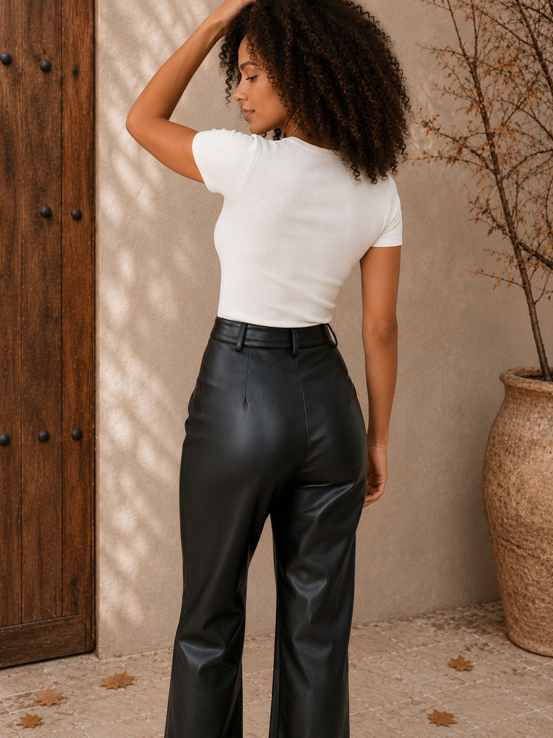 Women's faux leather trousers with side pockets and full-length straight legs