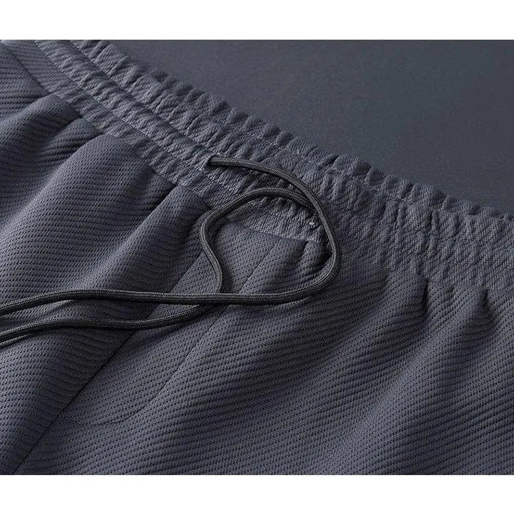 Men's jogger tracksuit set – side profile view showing drawstring waist and relaxed fit