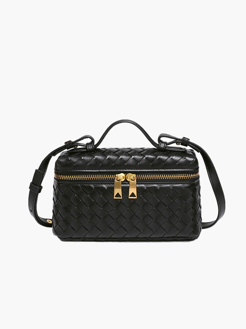 Women's woven shoulder bag showing textured exterior and double zipper closure