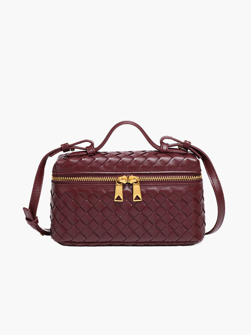 Women's structured woven bag with gold-tone zipper pulls and top carry handle