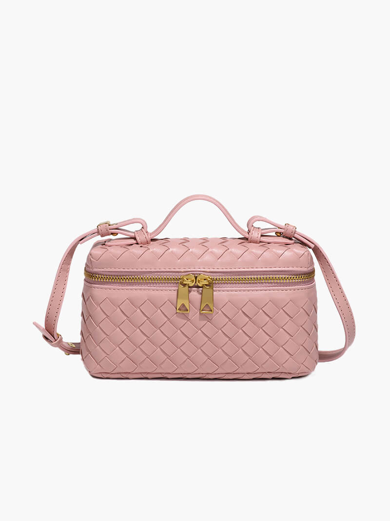 Women's woven shoulder bag worn over the shoulder, full-length lifestyle view