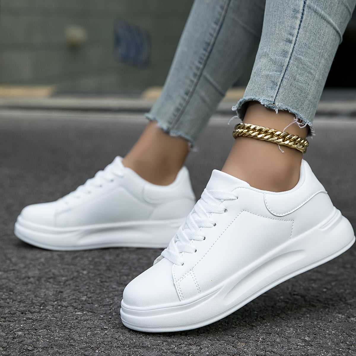 Rear view of women's low-profile lace-up sneakers showing heel and sole construction