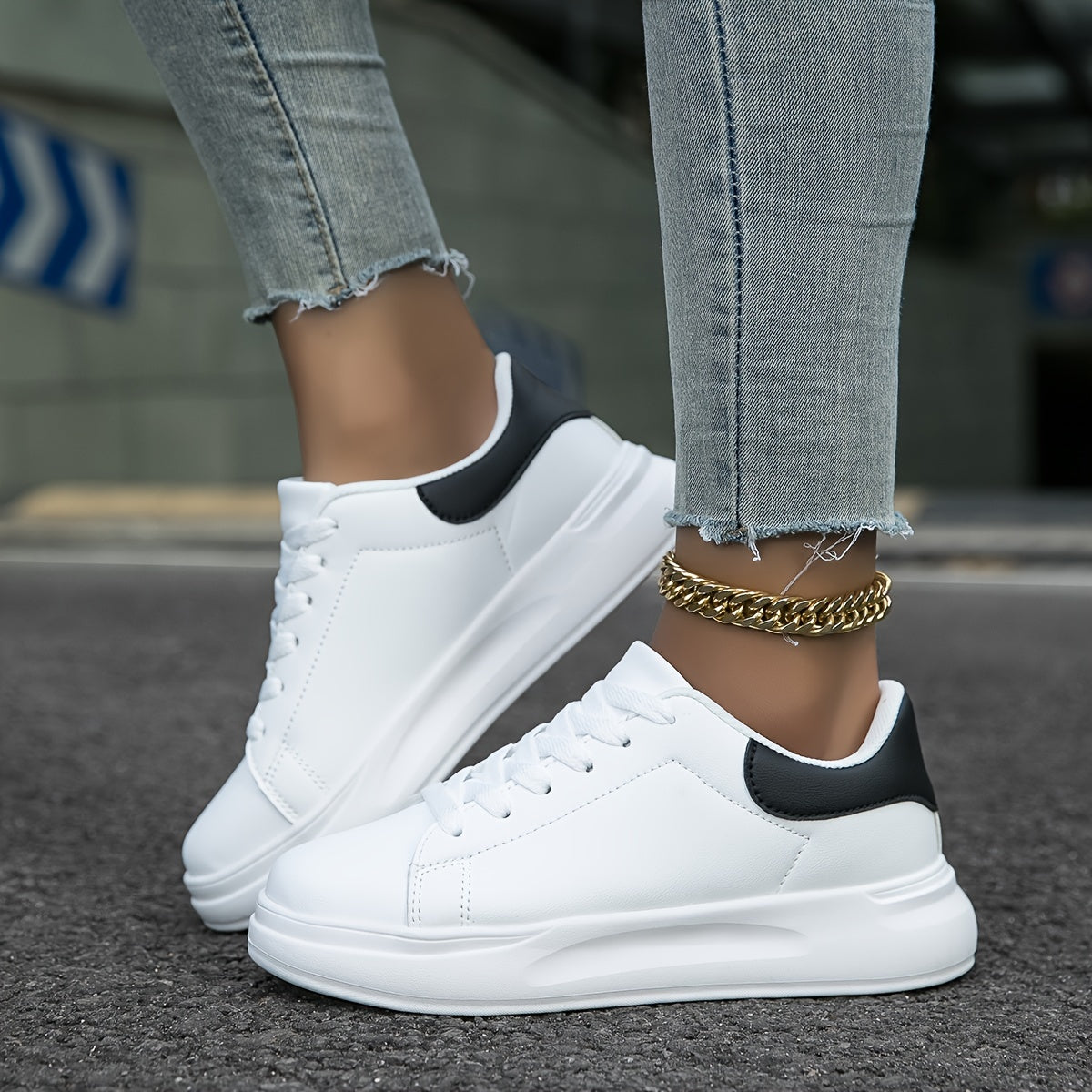 Sole view of women's low-profile sneakers showing flat synthetic outsole tread
