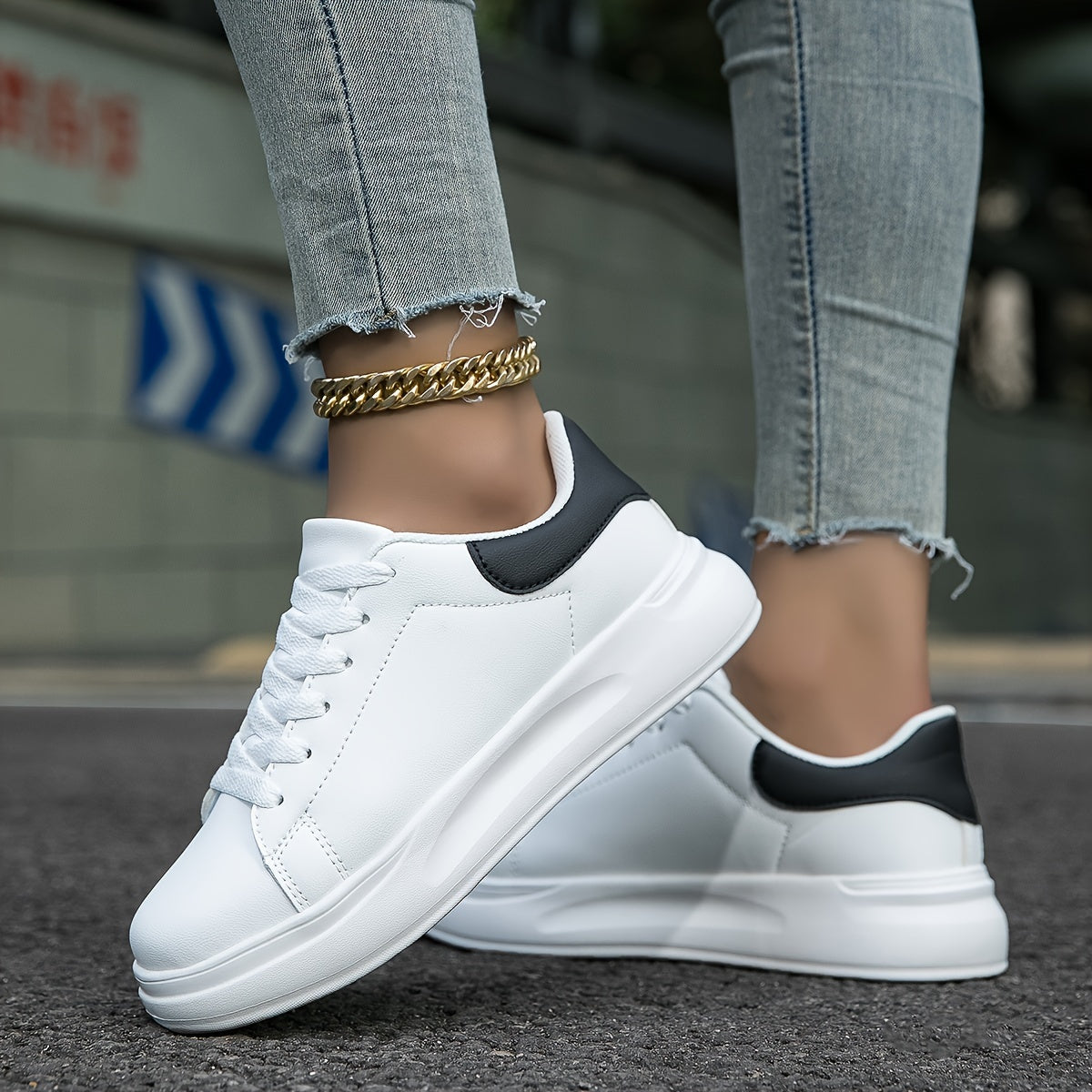 Women's low-profile synthetic leather sneakers in two-tone finish with lace-up closure